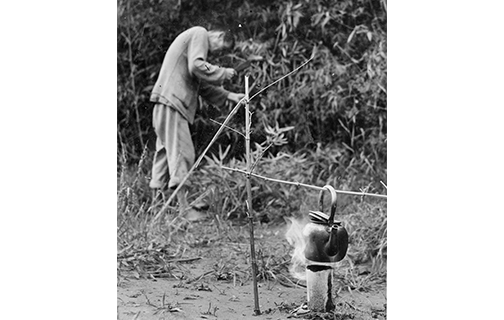 A farmer boiling water after igniting natural gas in his field (filmed in 1950)